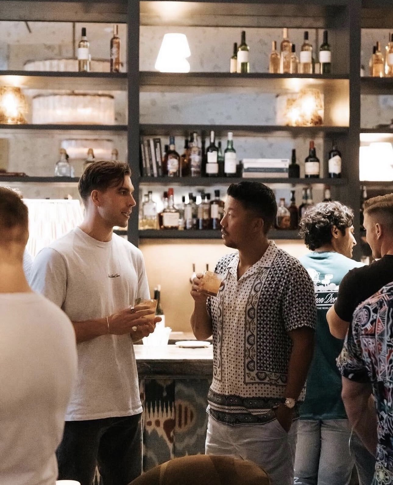 Members talking at the club bar